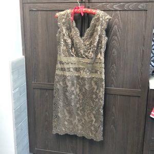 Beautiful olive with faint gold and lace details.